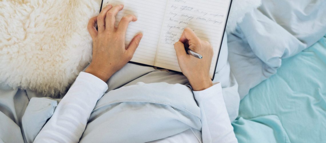 Woman,Journaling,In,Cozy,Bed